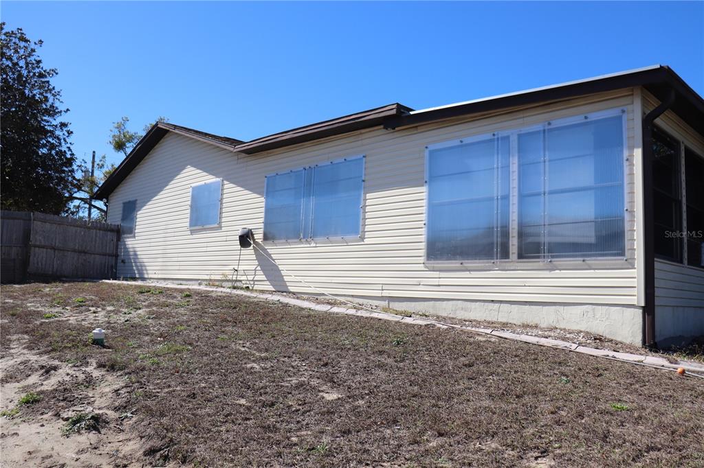 12387 Seagate Street Spring Hill, FL 34609 - Photo 34 of 51 a backyard of a house