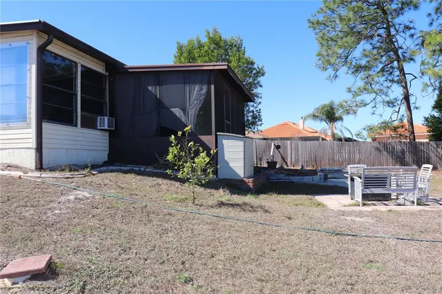 a view of a white house with a yard