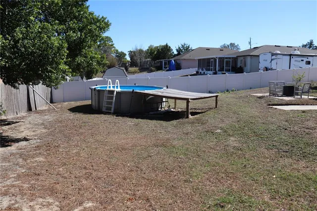 a view of a backyard of the house