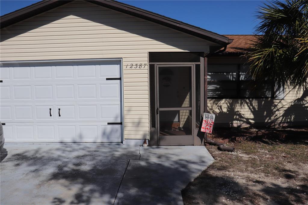 12387 Seagate Street Spring Hill, FL 34609 - Photo 49 of 51 a view of a house with a yard