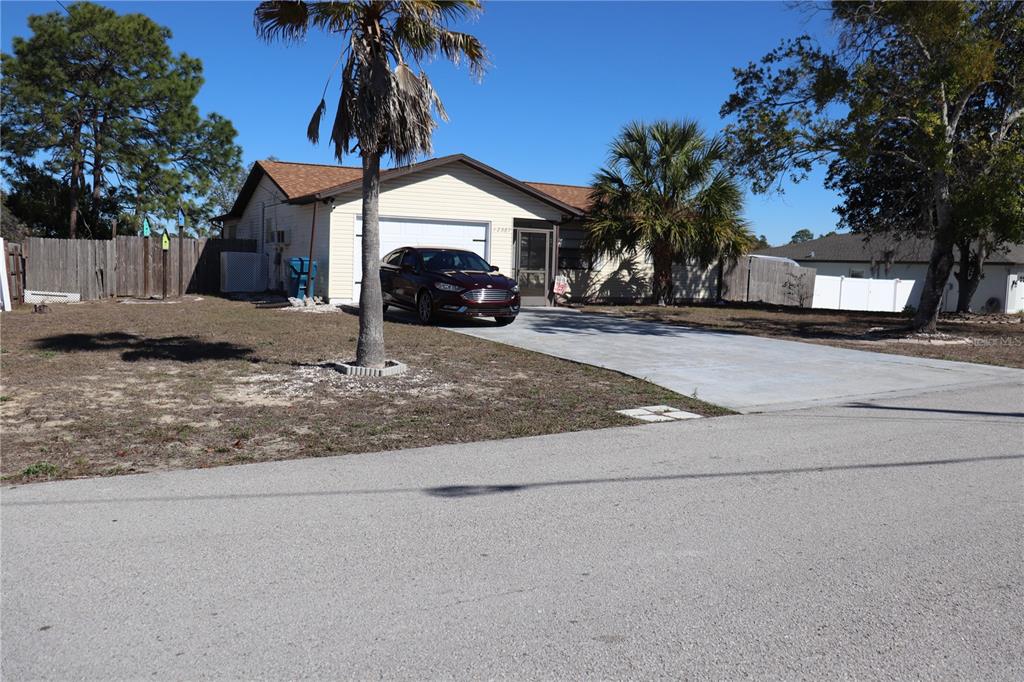 12387 Seagate Street Spring Hill, FL 34609 - Photo 50 of 51 a house view with a outdoor space
