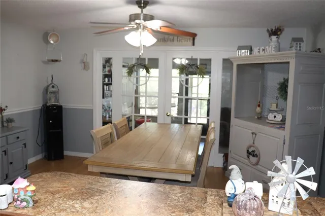 a living room with hard wood flooring and a couch
