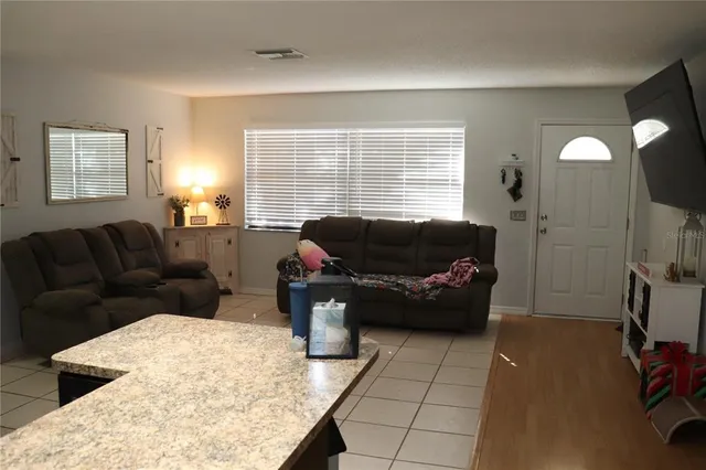 a living room with furniture and a couch