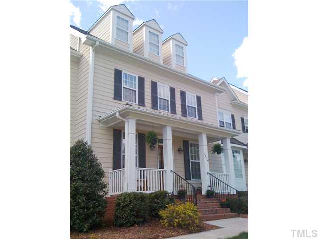 1234 Colonial Club Road Wake Forest, NC 27587 - Photo 1 of 25 Rocking chair front porch overlooks single family homes across the street and open wooded area. Lovley!!!