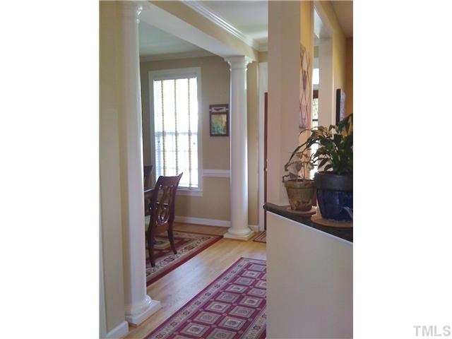 1234 Colonial Club Road Wake Forest, NC 27587 - Photo 8 of 25 This area of the foyer open to the dining room and features stunning round columns and lots of beautiful trim work.