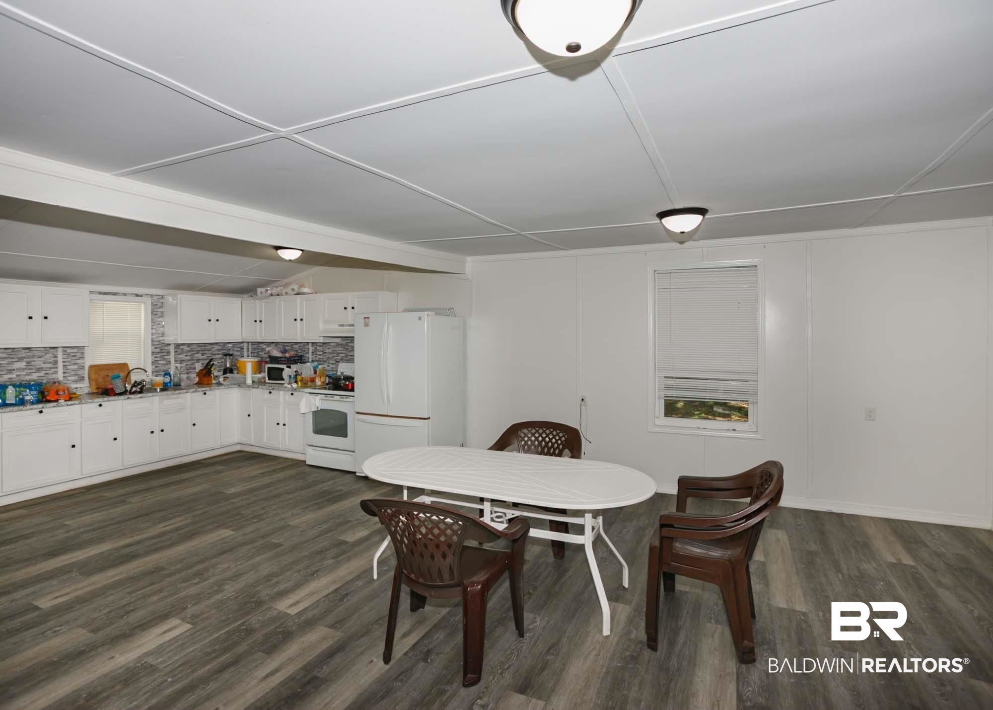 11998 Workman Avenue Foley, AL 36535 - Photo 10 of 59 Dining space with dark wood finished floors
