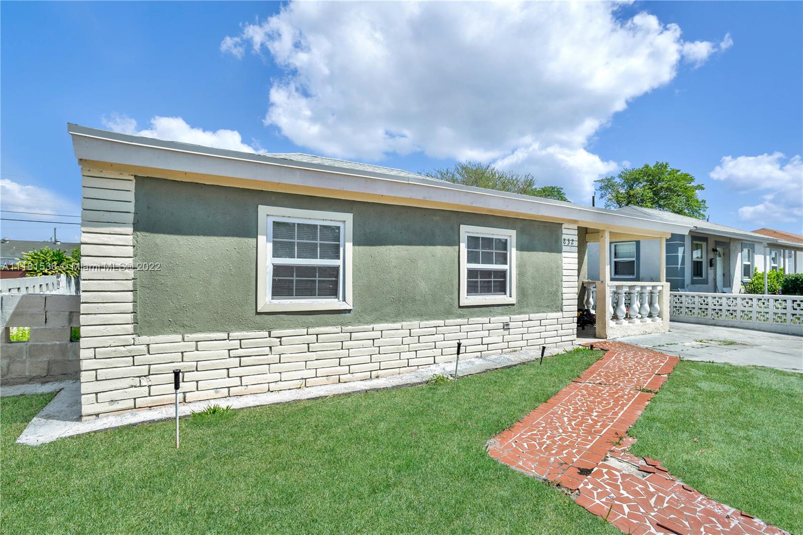 832 West 4th Street Riviera Beach, FL 33404 - Photo 3 of 21 front view of a house with a yard