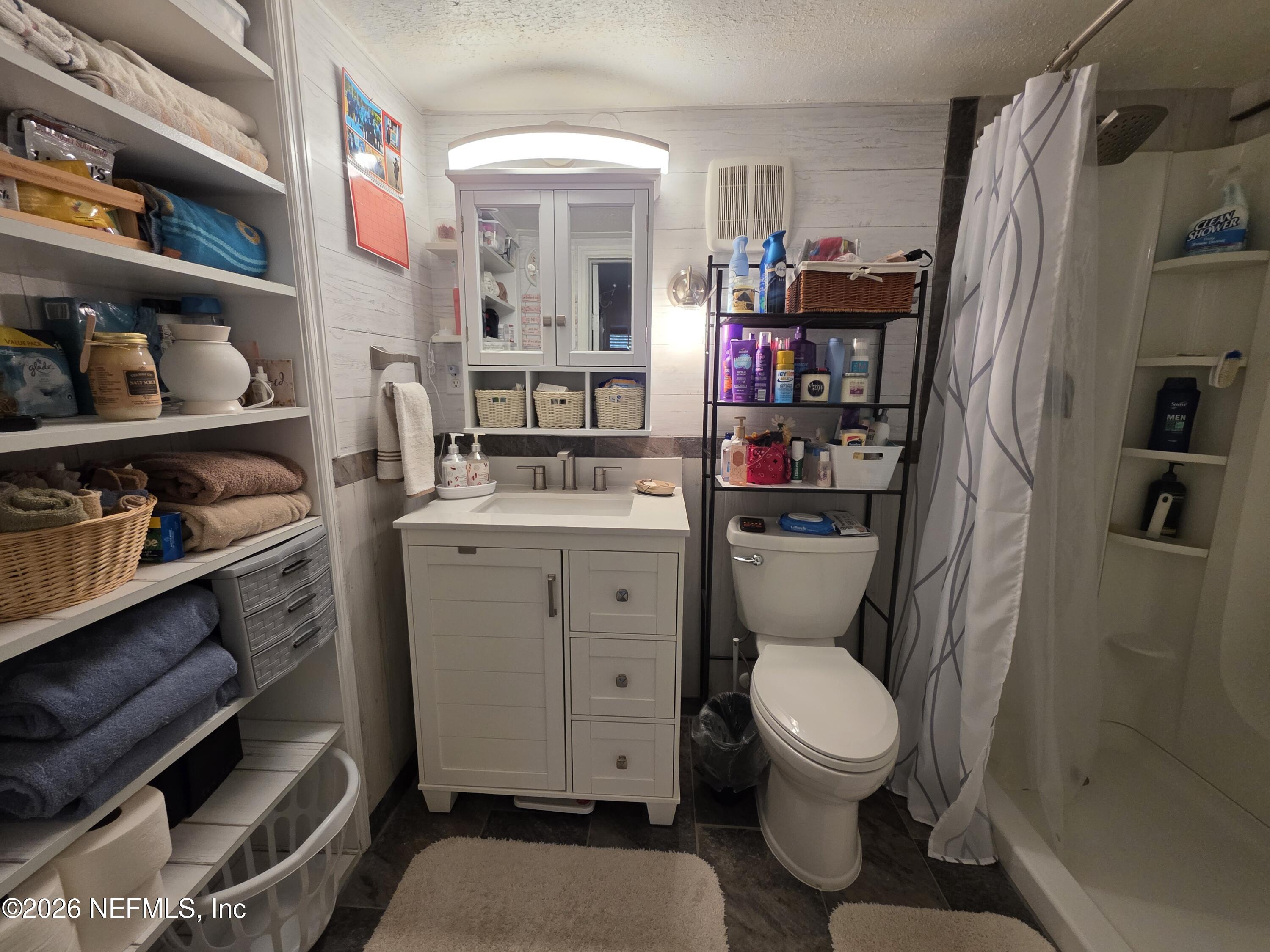 508 Edgewood Avenue Crescent City, FL 32112 - Photo 13 of 71 a bathroom with a toilet a sink and a shower