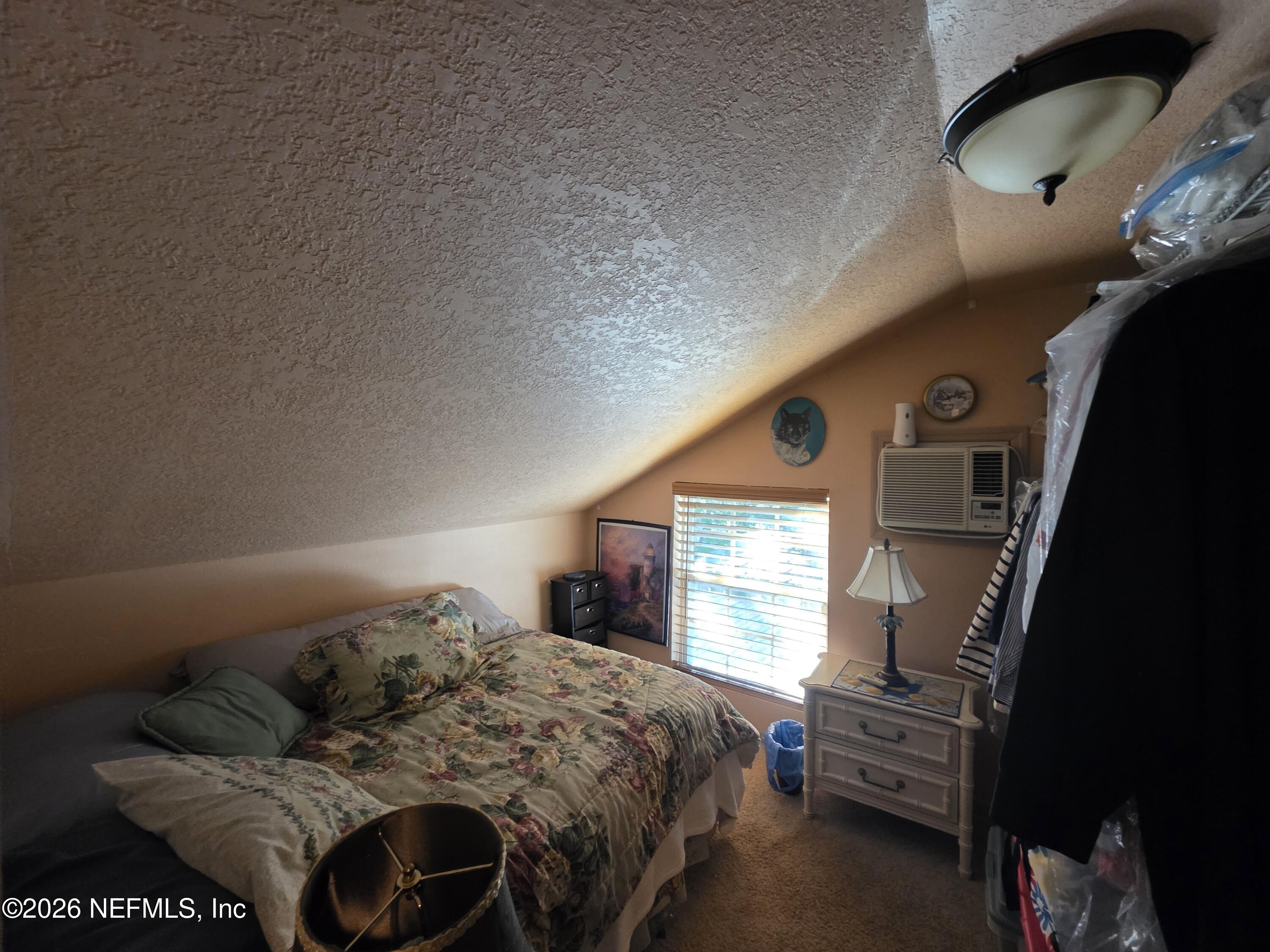 508 Edgewood Avenue Crescent City, FL 32112 - Photo 24 of 71 a bedroom with a bed and window