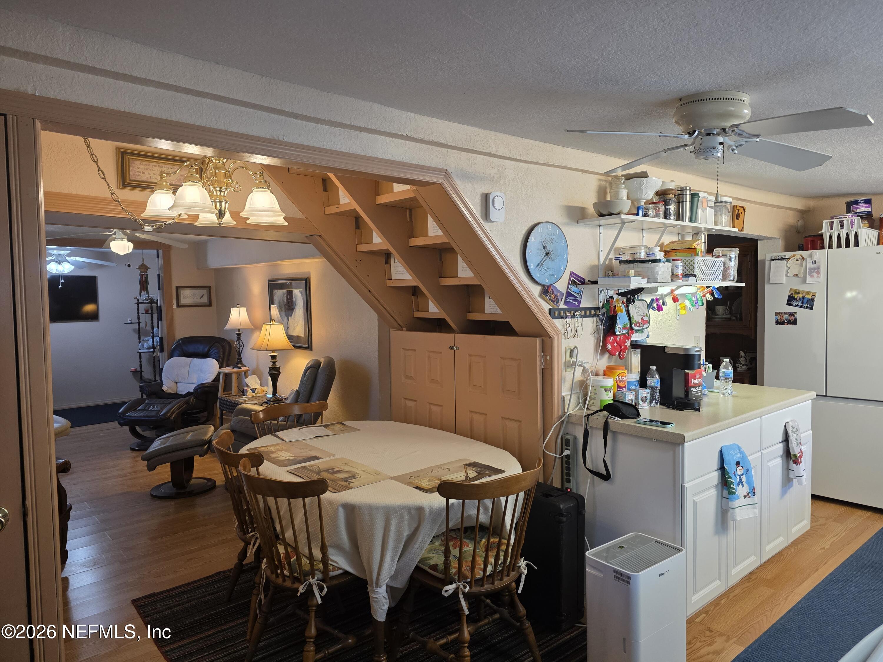 508 Edgewood Avenue Crescent City, FL 32112 - Photo 34 of 71 a view of a dining room with furniture carpet and a chandelier