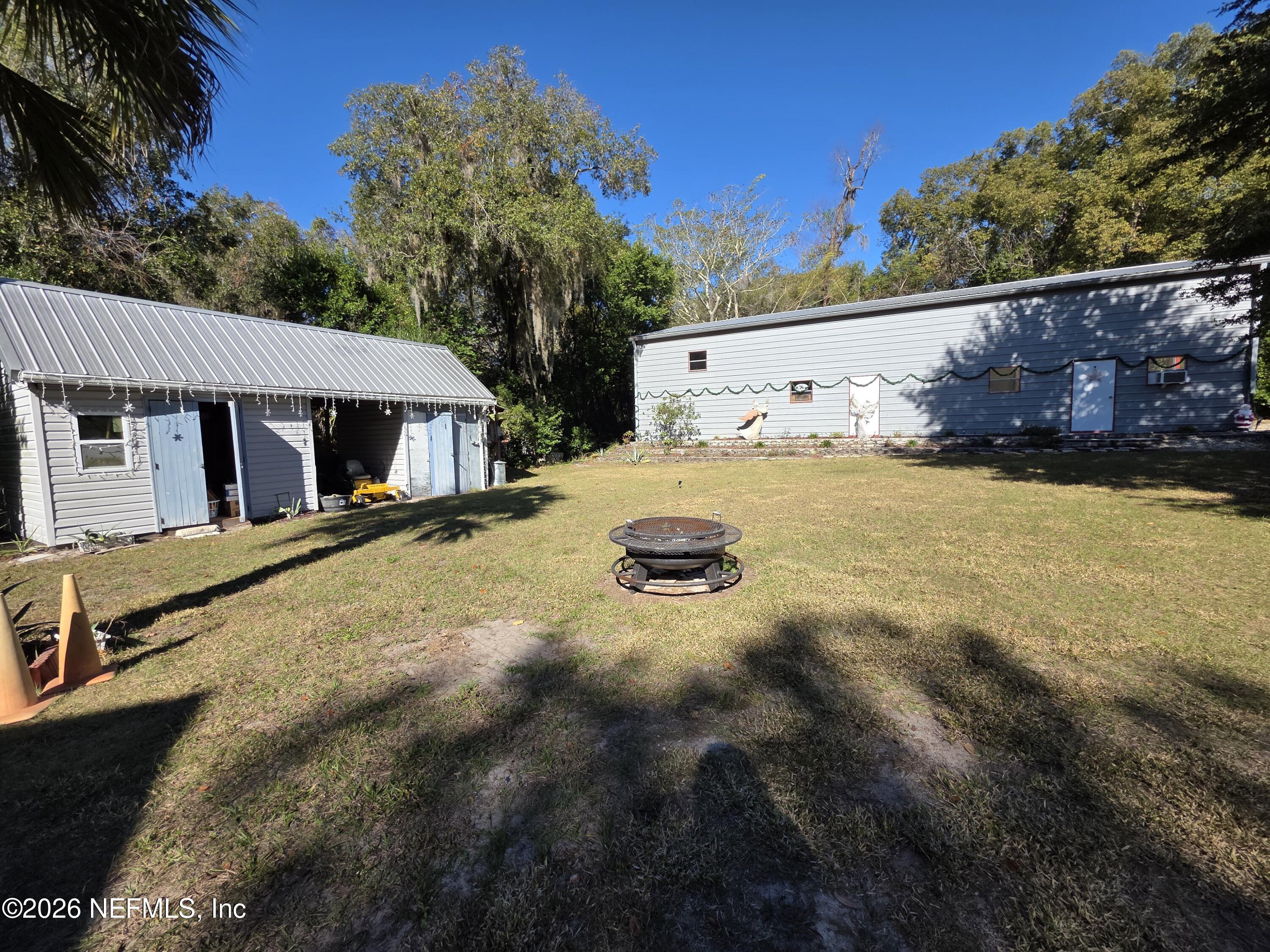 508 Edgewood Avenue Crescent City, FL 32112 - Photo 38 of 71 a view of a house with pool and sitting area