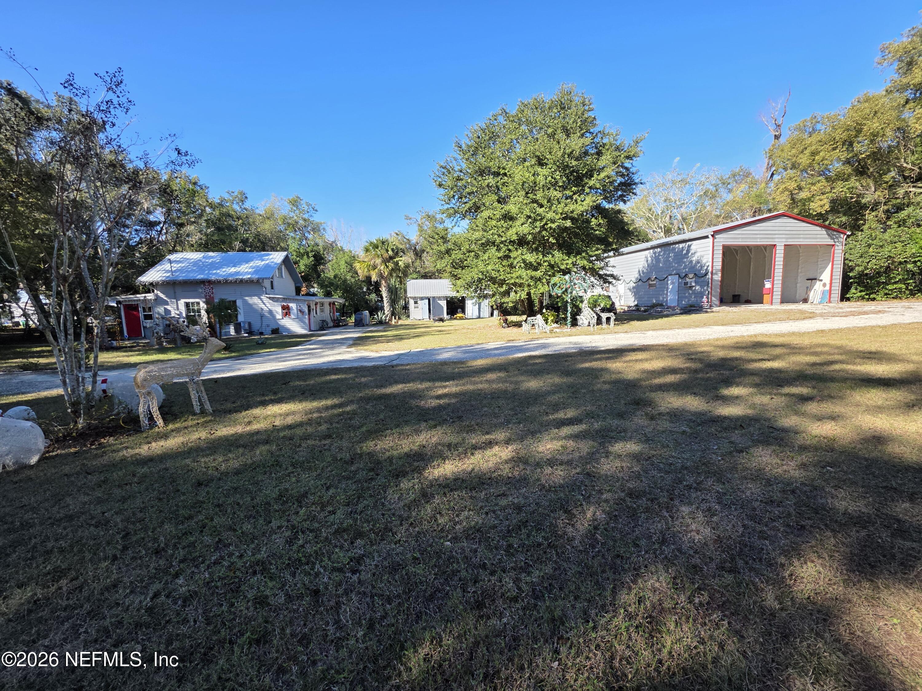 508 Edgewood Avenue Crescent City, FL 32112 - Photo 66 of 71 a front view of a house with a yard and trees