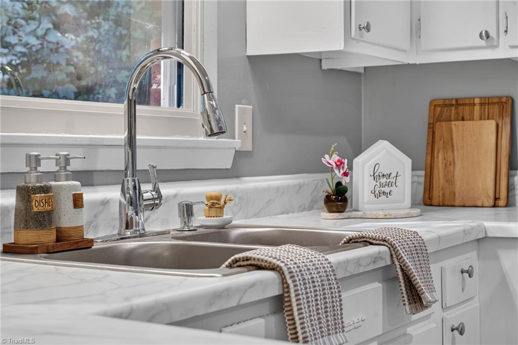 113 Green Valley Road Greensboro, NC 27403 - Photo 14 of 46 Thoughtful details make this kitchen as beautiful as it is functional. Ready for you to make it your own!