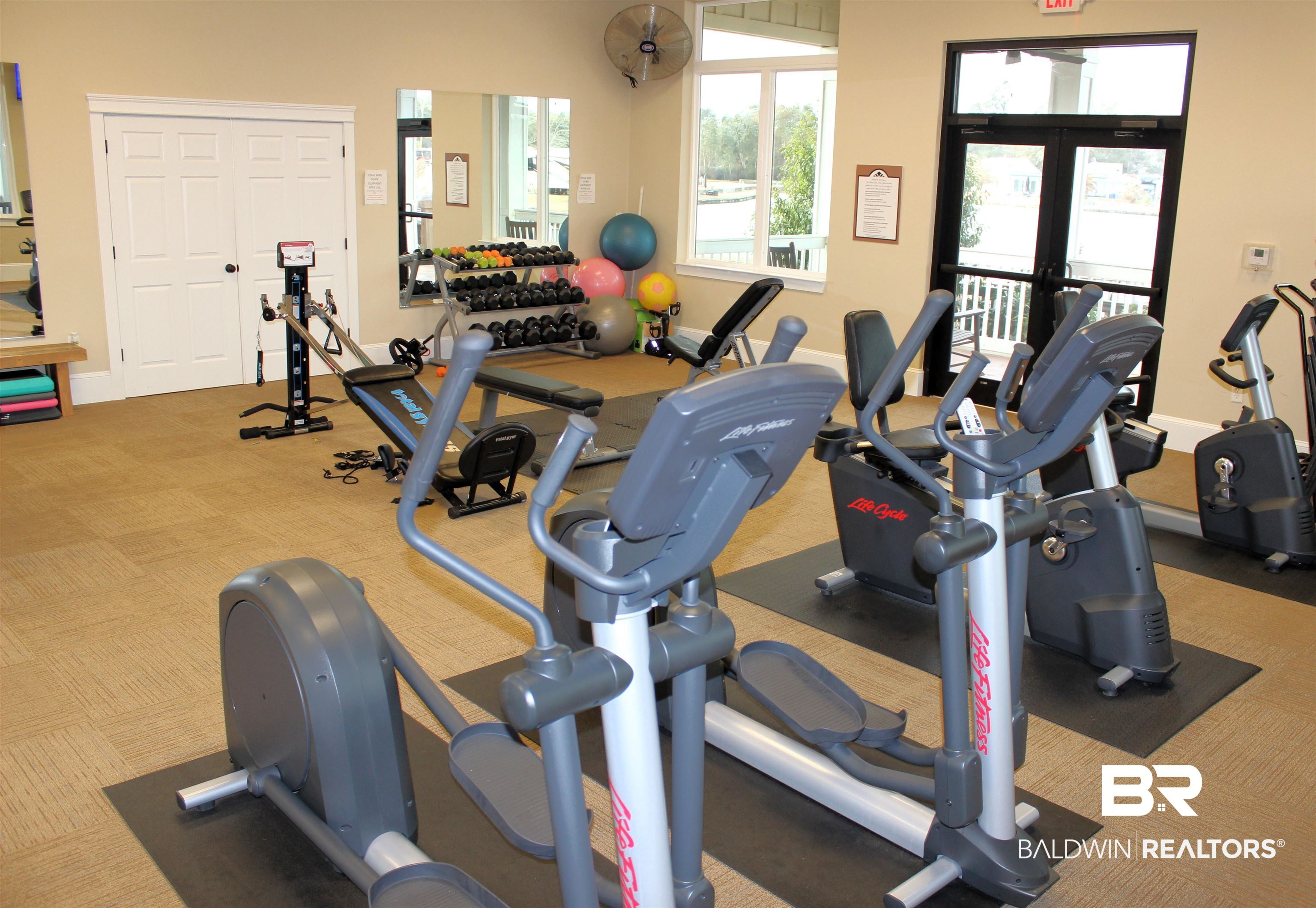 11869 Gateway Drive Elberta, AL 36530 - Photo 28 of 78 Workout area featuring french doors and carpet floors