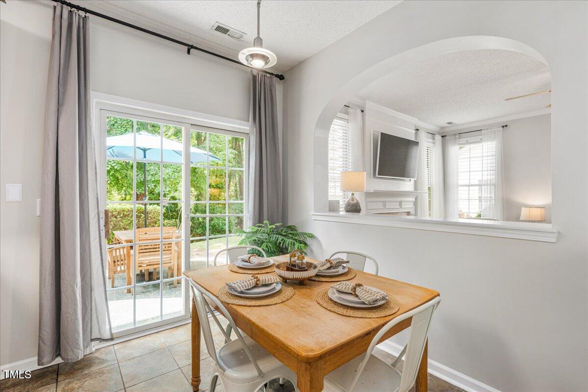 4524 Drewbridge Way Raleigh, NC 27604 - Photo 12 of 29 a view of a dining room with furniture window and outside view