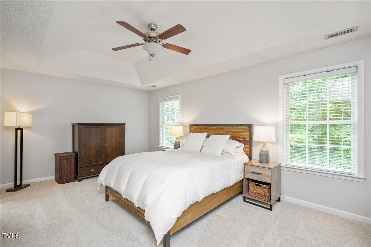 4524 Drewbridge Way Raleigh, NC 27604 - Photo 14 of 29 a bedroom with a bed and a window