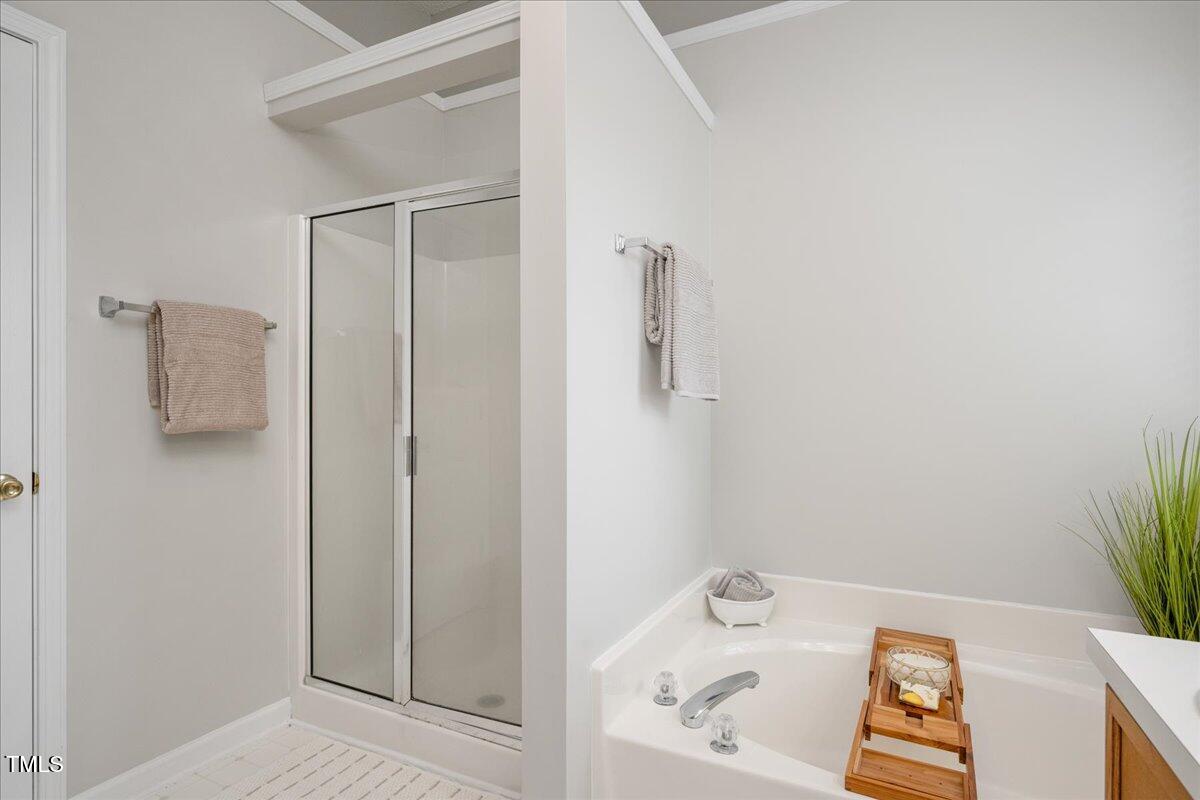 4524 Drewbridge Way Raleigh, NC 27604 - Photo 17 of 29 a bathroom with a bathtub