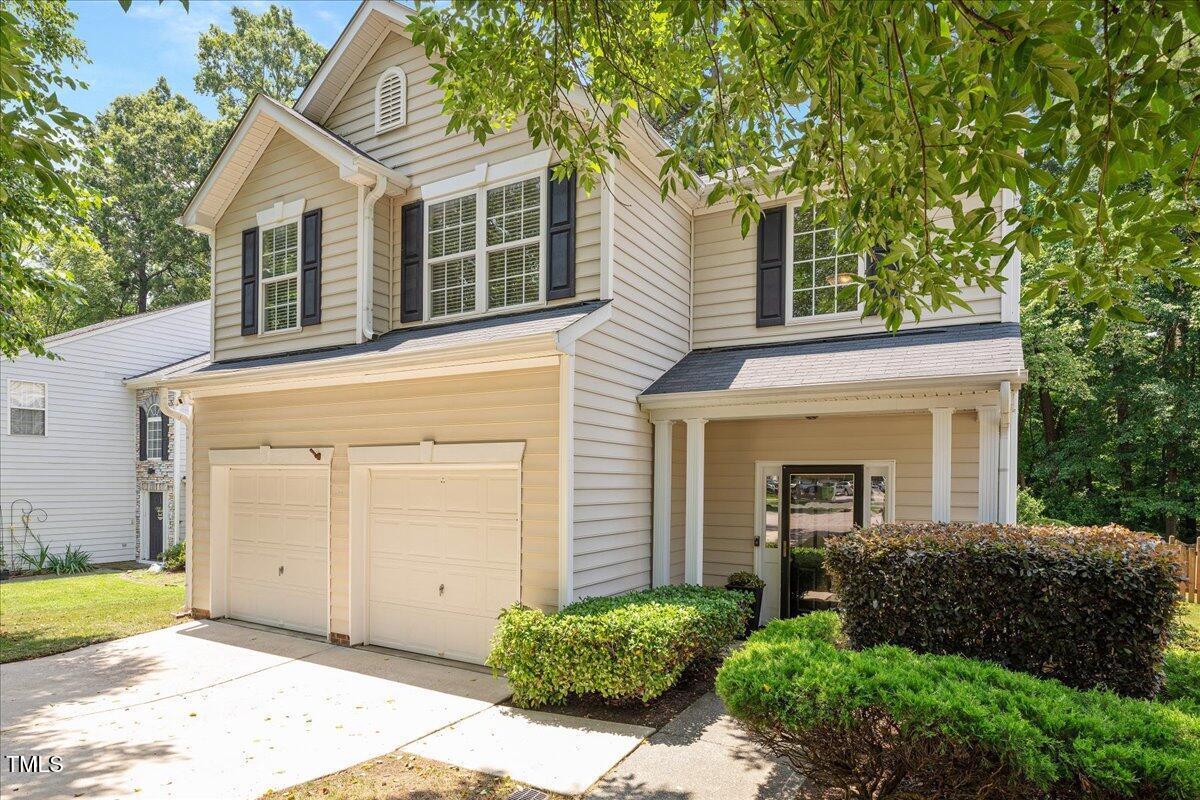 4524 Drewbridge Way Raleigh, NC 27604 - Photo 2 of 29 a front view of a house with a garden