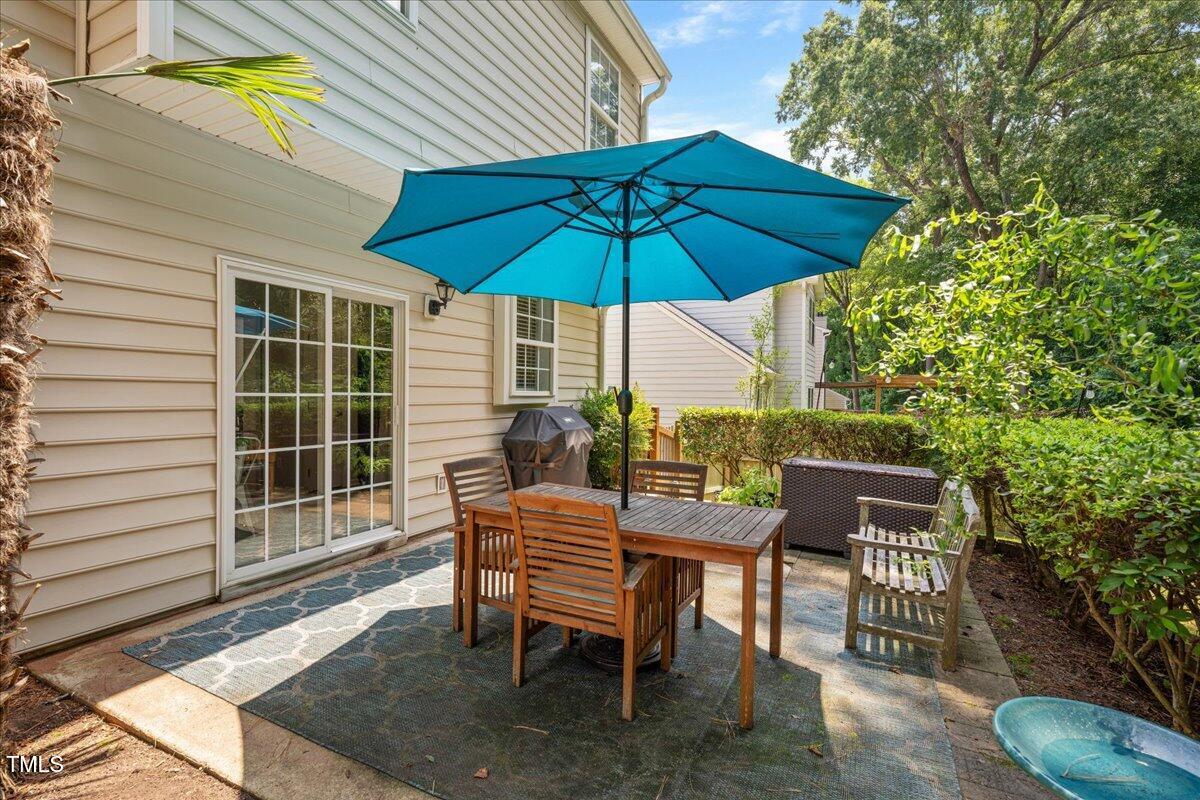 4524 Drewbridge Way Raleigh, NC 27604 - Photo 24 of 29 a view of a backyard with furniture and a table