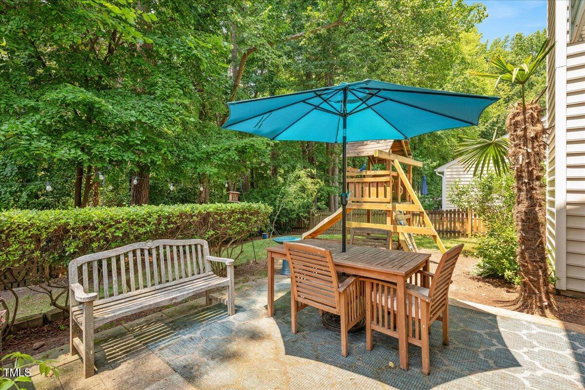 4524 Drewbridge Way Raleigh, NC 27604 - Photo 25 of 29 a view of a chair and table on the deck