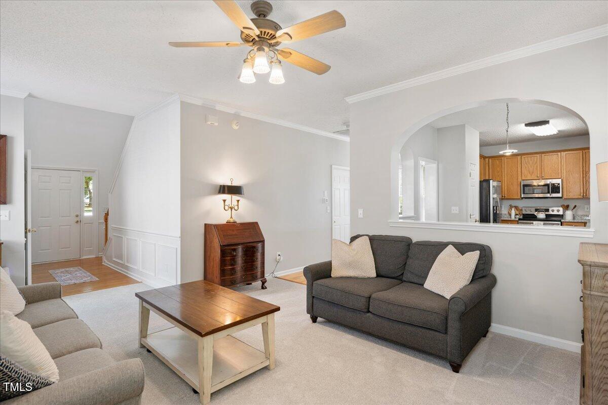 4524 Drewbridge Way Raleigh, NC 27604 - Photo 7 of 29 a living room with furniture and a fireplace