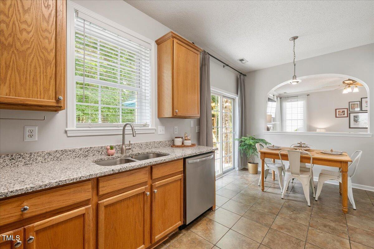 4524 Drewbridge Way Raleigh, NC 27604 - Photo 10 of 29 a kitchen with a sink a counter top space and appliances