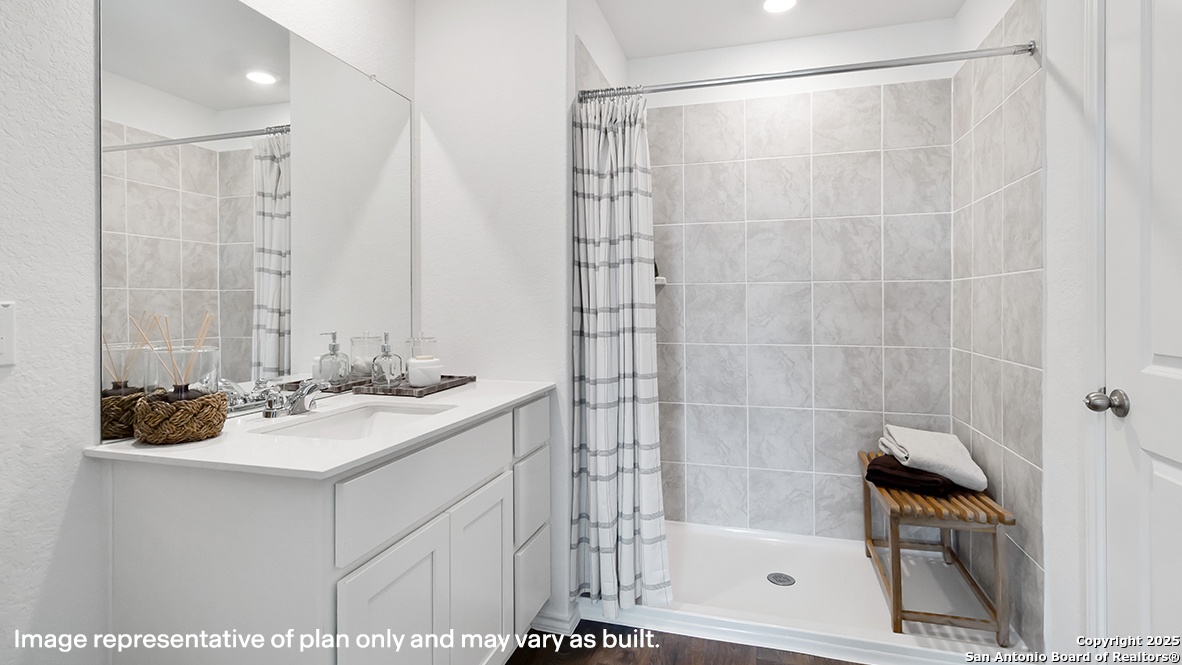 12602 Desert Fox Converse, TX 78109 - Photo 23 of 49 a bathroom with a sink and a mirror