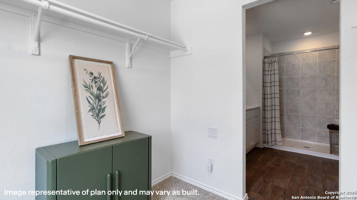 12602 Desert Fox Converse, TX 78109 - Photo 24 of 49 a view of a hallway with wooden floor and a bathroom