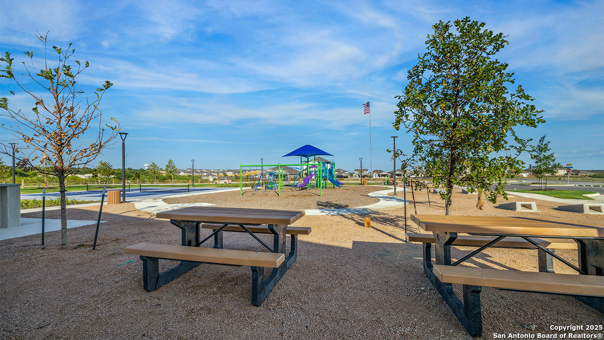 12602 Desert Fox Converse, TX 78109 - Photo 46 of 49 a view of swimming pool with outdoor seating and trees in the background