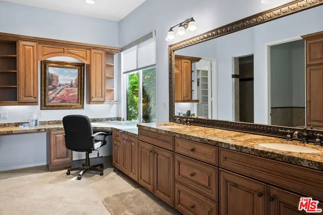 a large bathroom with a large tub and sink