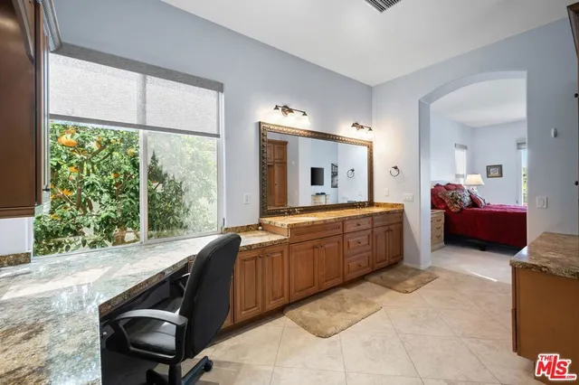 a bed room with a bed and a tv