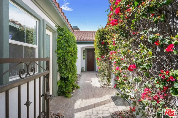 a flower plants in front of a house