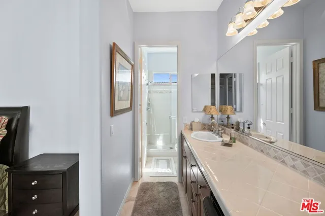 a view of a backyard with plants and a patio