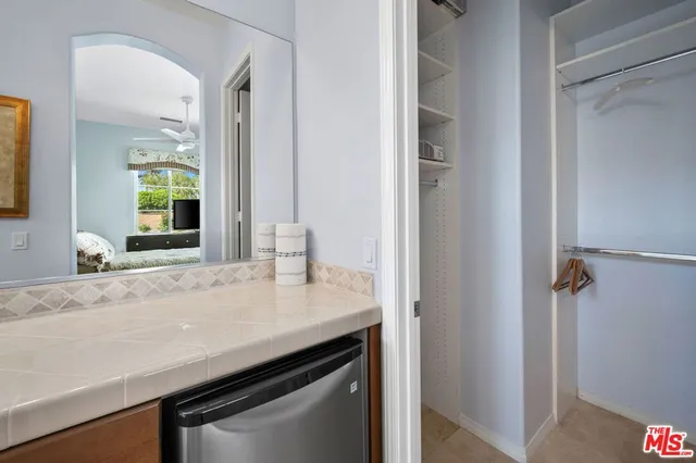 a view of a backyard and swimming pool