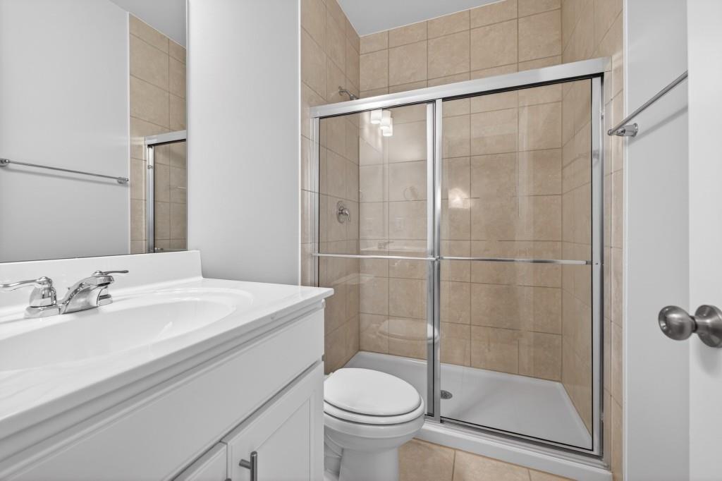 7277 Maple Brook Lane Flowery Branch, GA 30542 - Photo 38 of 93 a bathroom with a sink toilet and shower