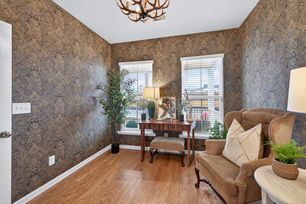 7277 Maple Brook Lane Flowery Branch, GA 30542 - Photo 42 of 93 a living room with furniture and a potted plant