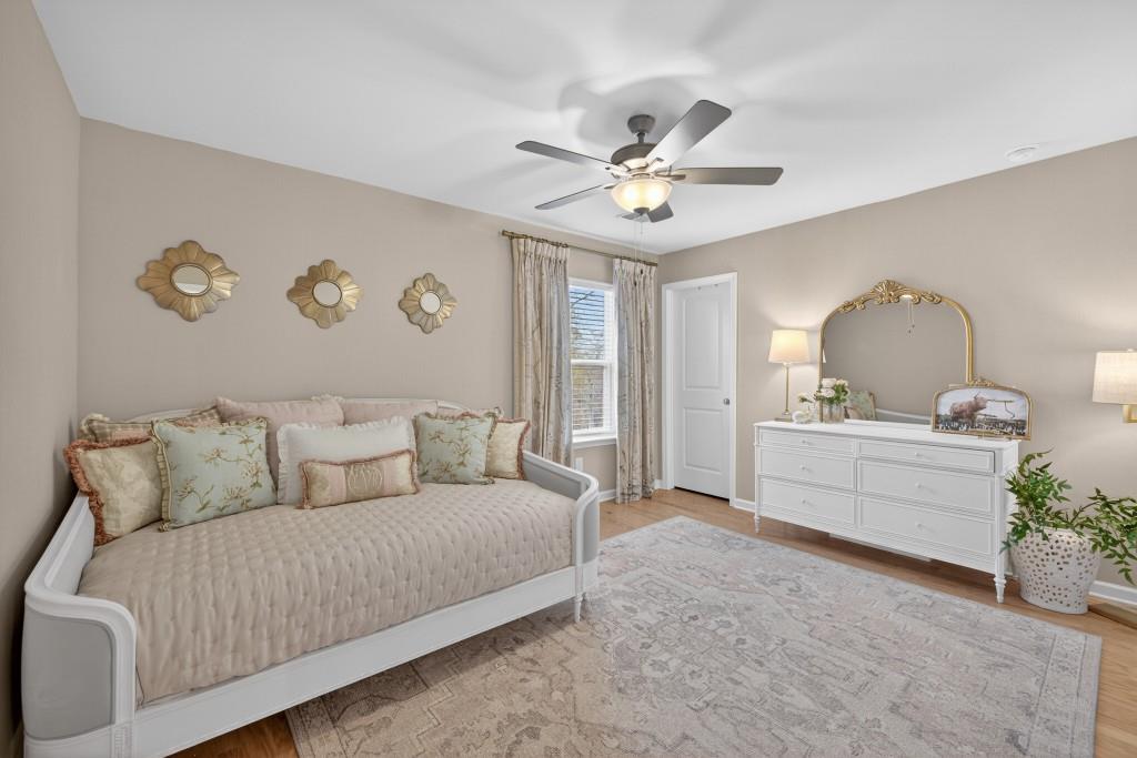 7277 Maple Brook Lane Flowery Branch, GA 30542 - Photo 51 of 93 a living room with furniture and a large window