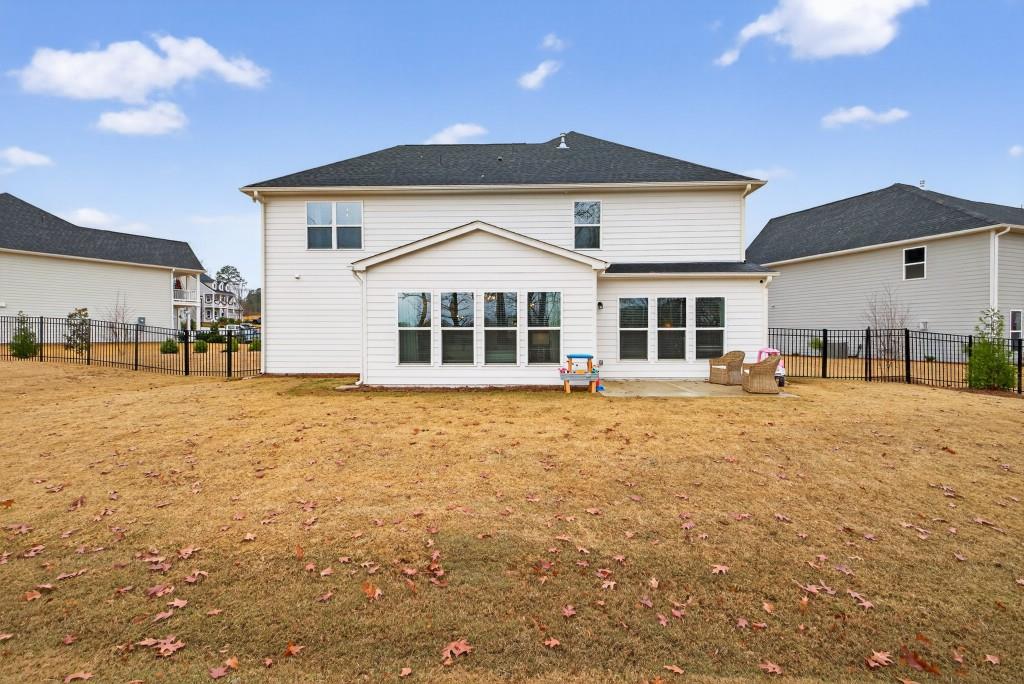 7277 Maple Brook Lane Flowery Branch, GA 30542 - Photo 74 of 93 a front view of a house with a yard