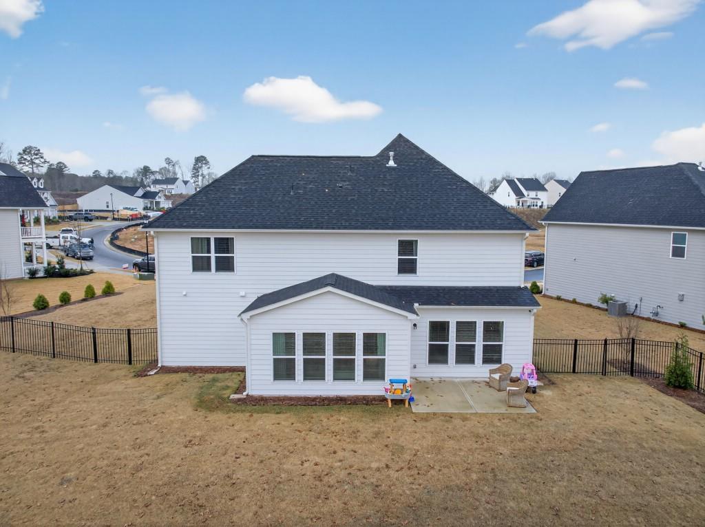 7277 Maple Brook Lane Flowery Branch, GA 30542 - Photo 77 of 93 a front view of a house with a yard