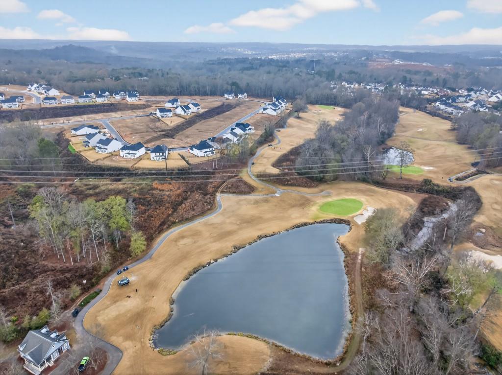 7277 Maple Brook Lane Flowery Branch, GA 30542 - Photo 82 of 93 an aerial view of a house with a swimming pool