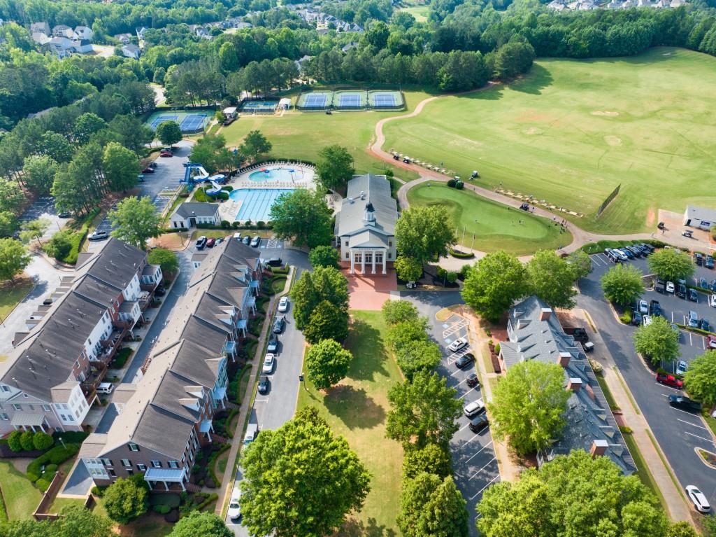 7277 Maple Brook Lane Flowery Branch, GA 30542 - Photo 88 of 93 an aerial view of residential houses with outdoor space and swimming pool