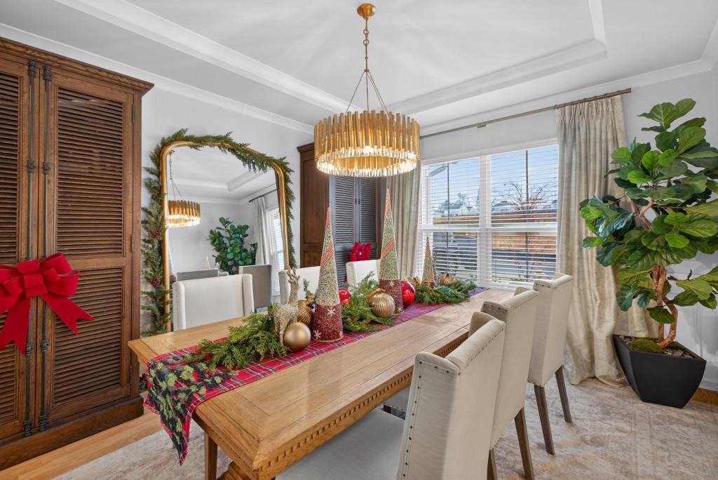 7277 Maple Brook Lane Flowery Branch, GA 30542 - Photo 9 of 93 a dining room with furniture window and natural light