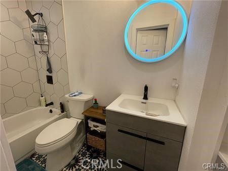 a bathroom with a sink toilet and a mirror