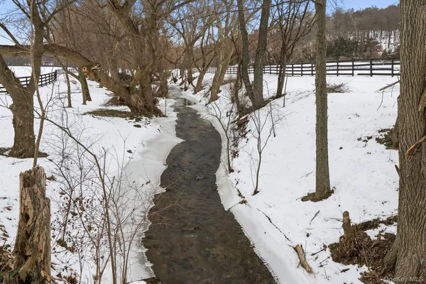 a view of swimming pool with a yard