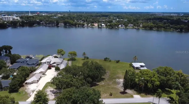 an aerial view of a house with a lake view