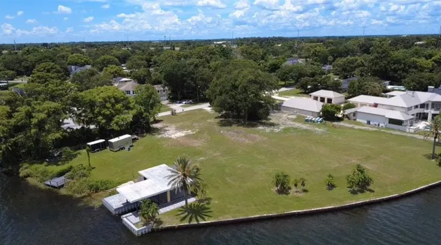 an aerial view of a house with a yard