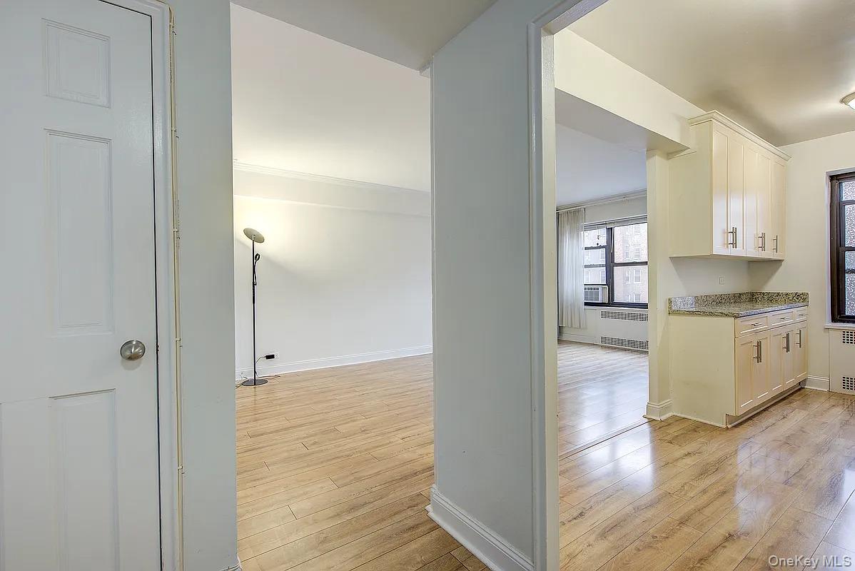 67-76 Booth Street, Unit 4F Queens, NY 11375 - Photo 15 of 33 a view of a kitchen cabinets and empty room