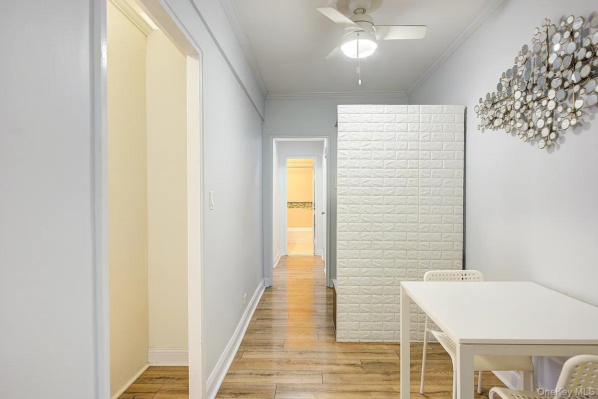 67-76 Booth Street, Unit 4F Queens, NY 11375 - Photo 17 of 33 a bathroom with a sink and a mirror