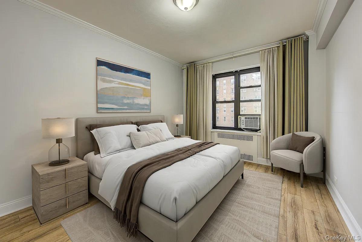 67-76 Booth Street, Unit 4F Queens, NY 11375 - Photo 23 of 33 a bedroom with bed and a couch