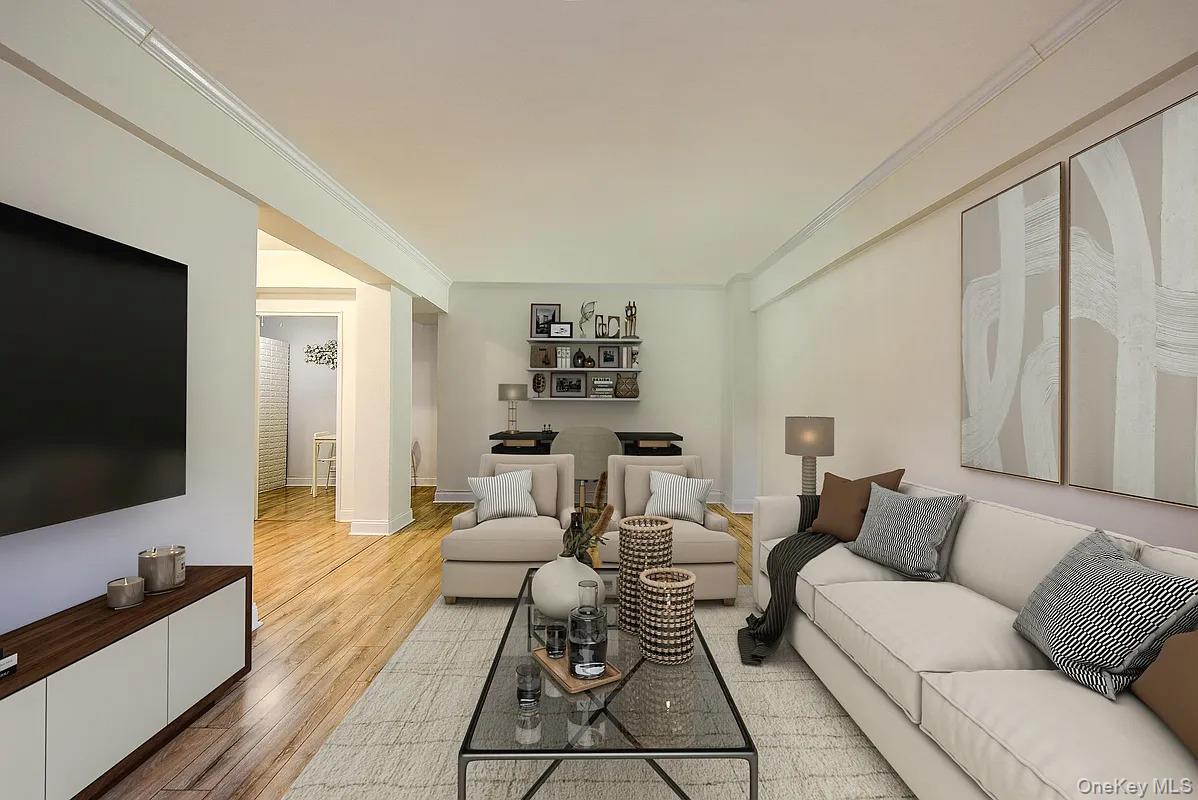 67-76 Booth Street, Unit 4F Queens, NY 11375 - Photo 6 of 33 a living room with furniture and a flat screen tv